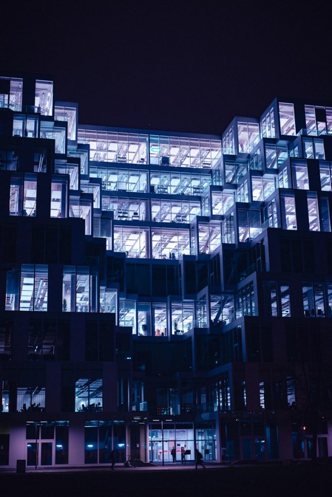 a building with many windows lit up at night